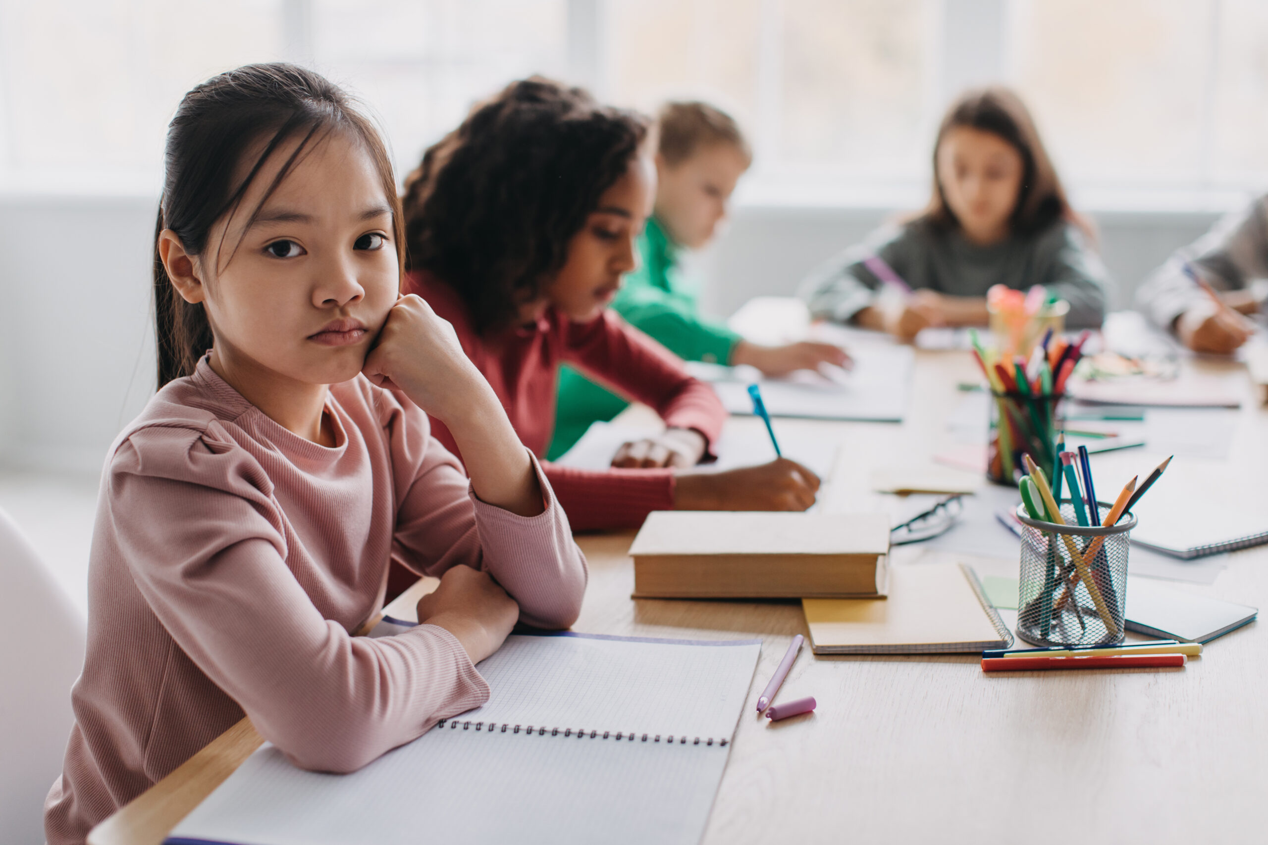 Sad elementary school girl, seemingly hurt, possibly Child Sexual Abuse